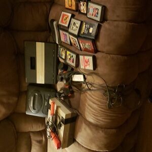Vintage Nintendo nes.001, atari with games,and Sega geniuses